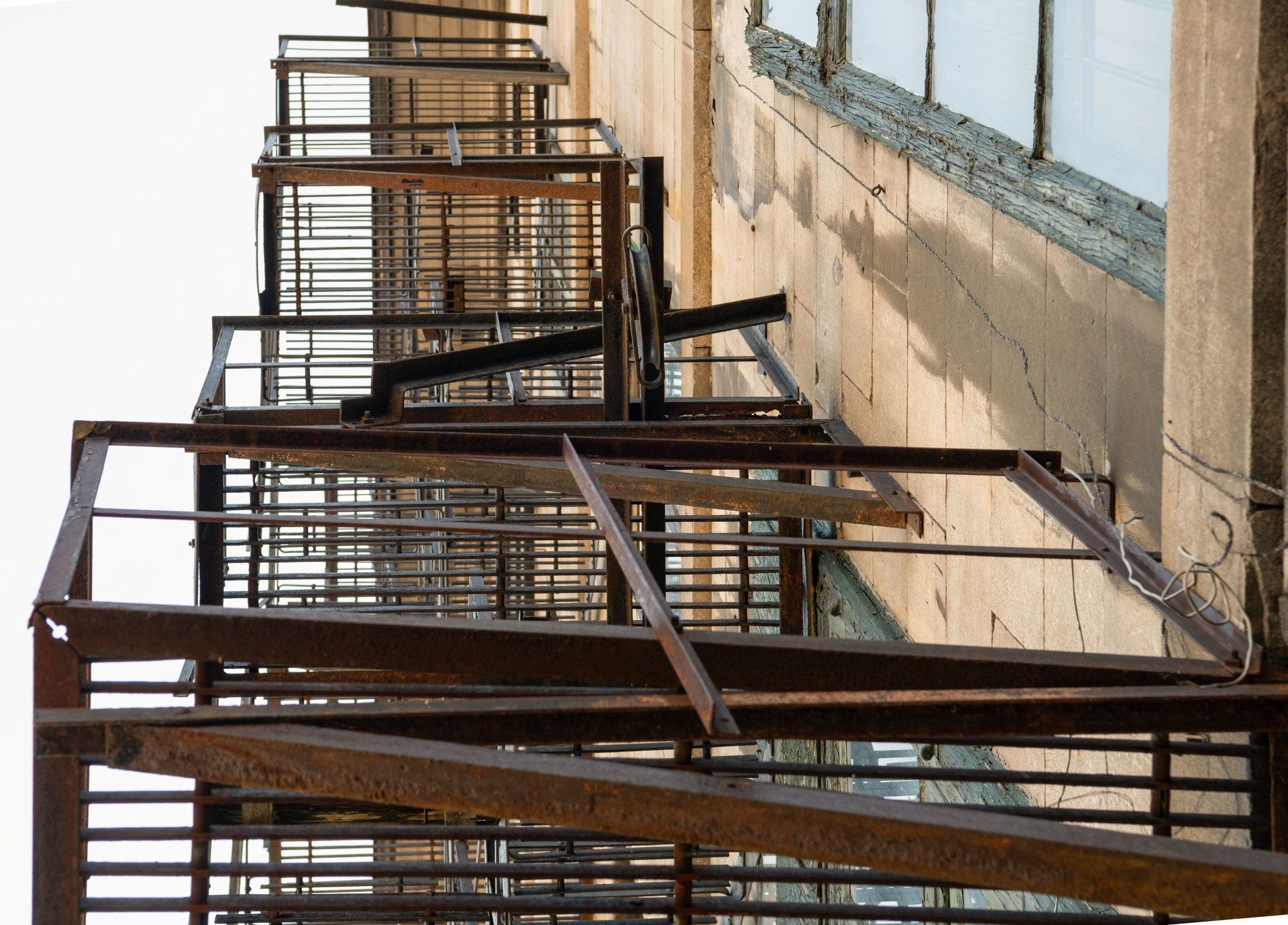 Rusted fire escape stairs outside on building