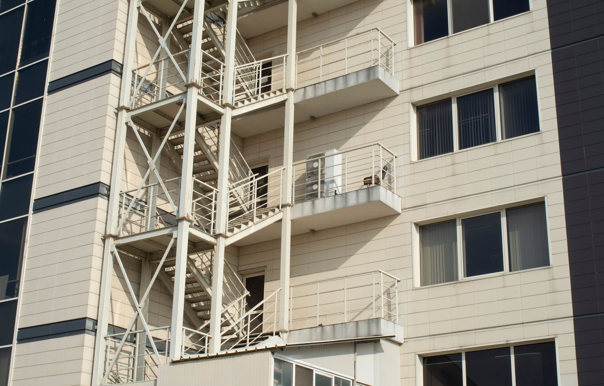 White external metal emergency staircase on building