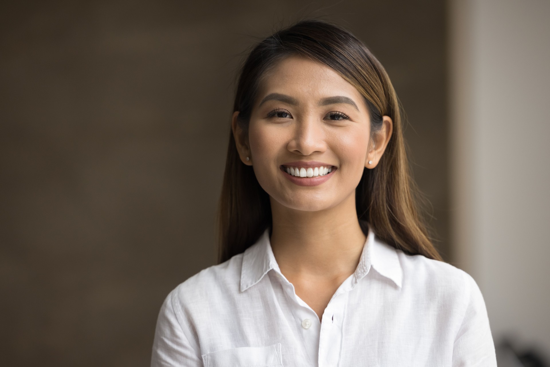 Closeup headshot portrait of young Asian businesswoman